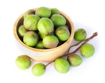 Chebulic Myrobalans in wood bowl isolated on white background, herb and medical