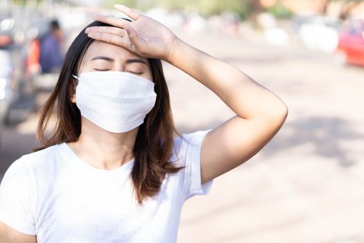 Closeup woman wearing face mask for protect air polution, health care and medical concept