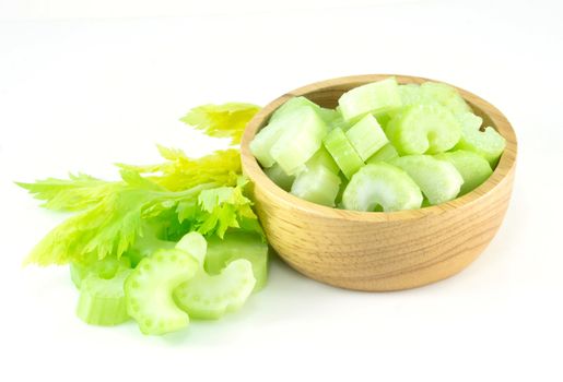 Fresh celery vegetable in wood bowl and sliced  isolated on white background, food for health