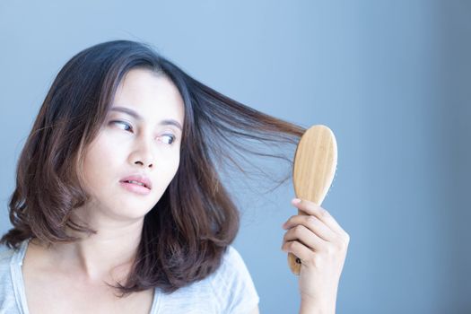 Woman serious hair loss problem for health care shampoo and beauty product concept, selective focus