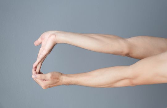 stretching exercises finger on grey background, health care and medical concept