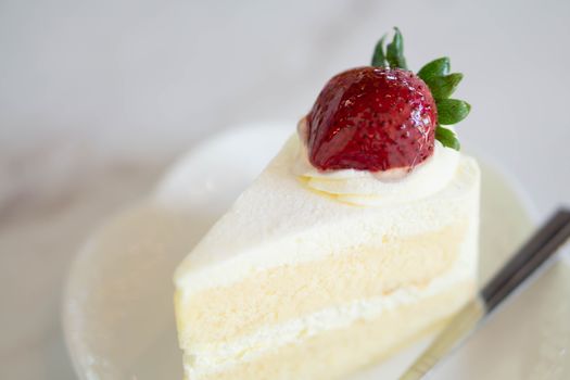 Closeup Milk cake delicious on glass table background, selective focus