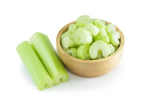 Fresh celery vegetable in wood bowl and sliced  isolated on white background, food for health