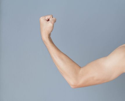 Back arm muscle man with grey background, health care and medical concept