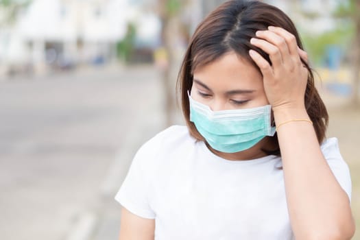 Closeup woman wearing face mask for protect air polution, health care and medical concept