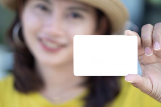 Closeup woman showing empty white credit card with smile face