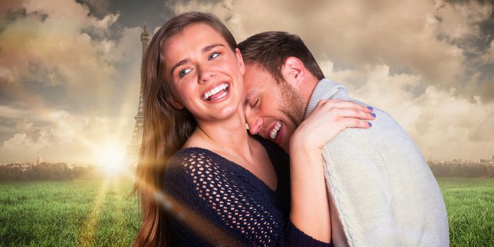 Close up of happy young couple against paris under cloudy sky