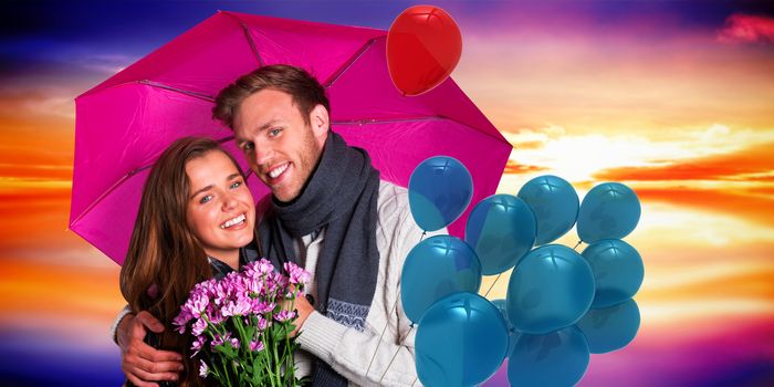 Cheerful young couple with flowers and umbrella against purple sky with orange clouds