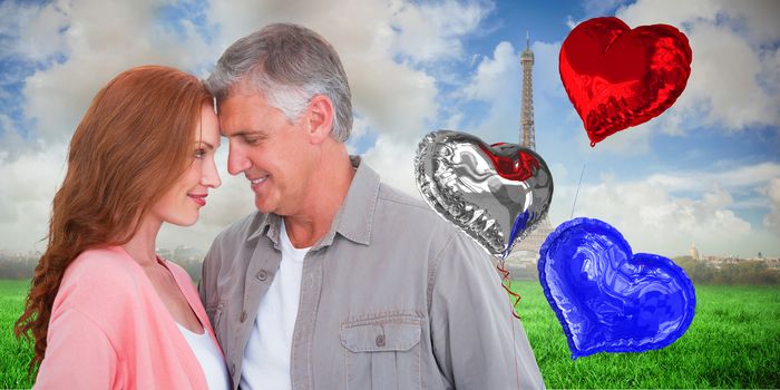 Casual couple hugging and smiling against eiffel tower