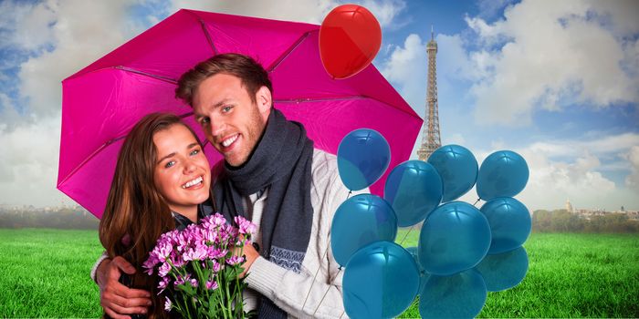 Cheerful young couple with flowers and umbrella against eiffel tower