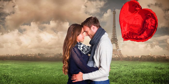 Side view of young couple embracing against paris under cloudy sky