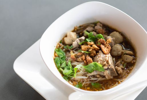 Rice noodle soup with Cooked Liver in  bowl on table, selective focus
