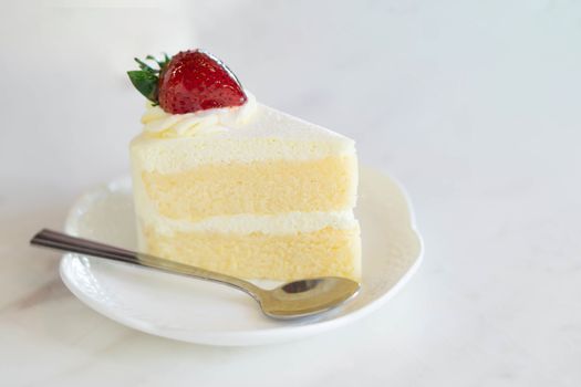 Closeup Milk cake delicious on glass table background, selective focus