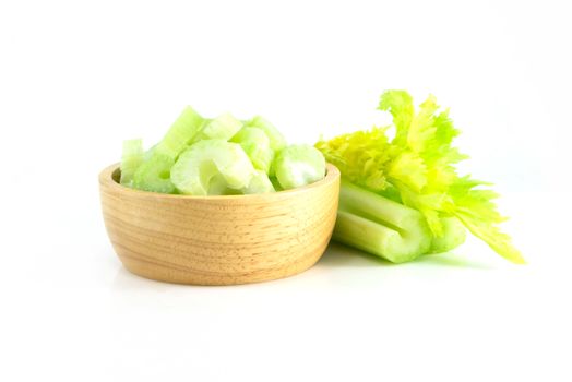 Fresh celery vegetable in wood bowl and sliced  isolated on white background, food for health