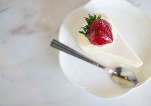 Closeup Milk cake delicious on glass table background, selective focus