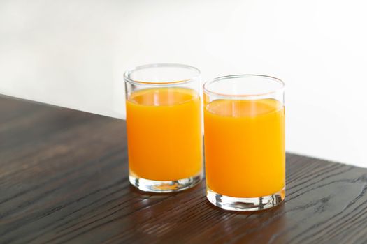 Closeup orange juice on wood table, drink for healthy concept, selective focus