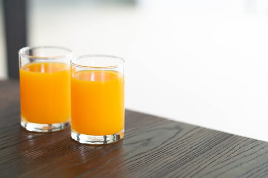 Closeup orange juice on wood table, drink for healthy concept, selective focus