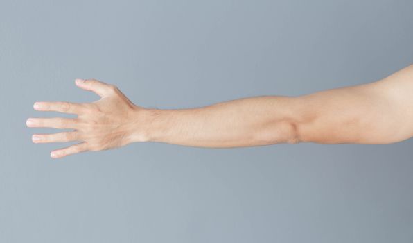 Close up man hand with grey background, health care concept