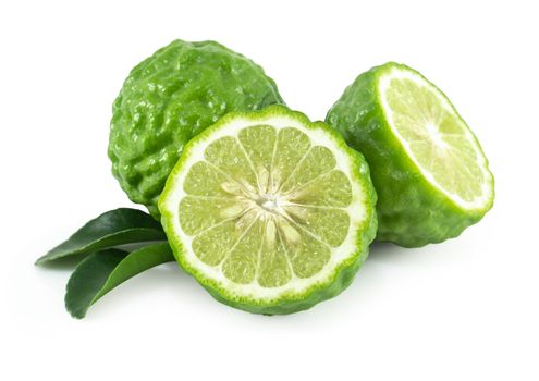 Fresh bergamot fruit slice with green leaf isolated on white background, herb and medical