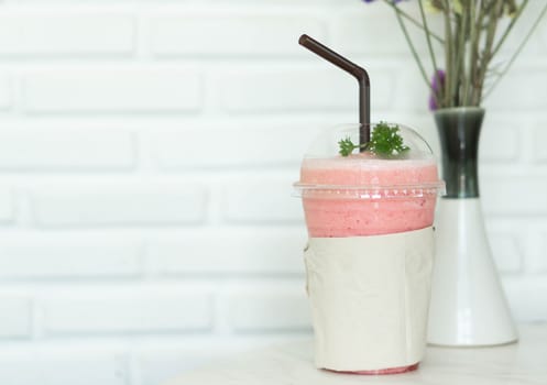 Closeup  strawberry smoothie on table, selective focus