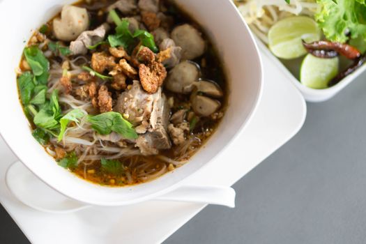 Rice noodle soup with Cooked Liver in  bowl on table, selective focus