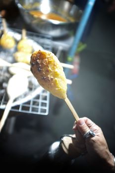 Grilled rice ball or Khao Jee: grilling yellow sticky rices, Thai style grilling 