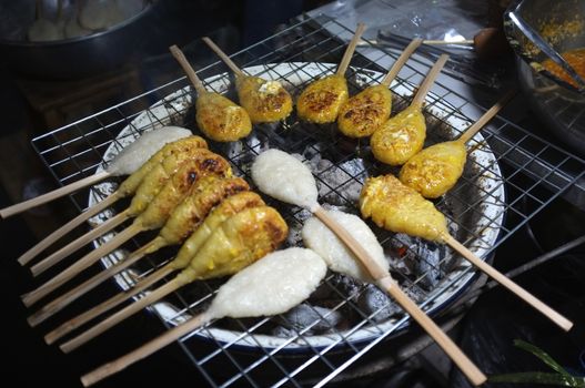Grilled rice ball or Khao Jee: grilling yellow sticky rices, Thai style grilling 