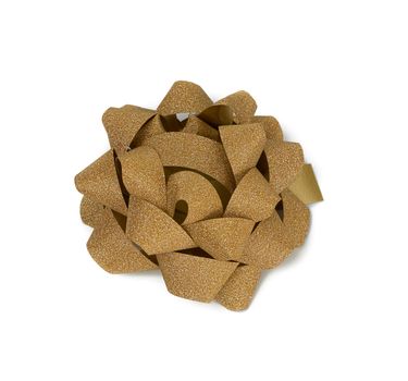 knotted bow made of golden shiny paper ribbon, decor is isolated on a white background, top view