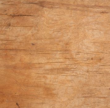 texture of a old brown wooden cutting board, full frame, backdrop for the designer, close up