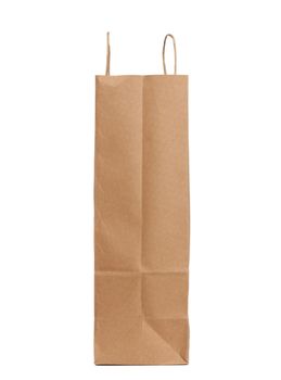 disposable brown craft paper bag with handles isolated on a white background