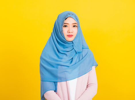 Asian Muslim Arab, Portrait of happy beautiful young woman religious wear veil hijab smiling studio shot isolated, yellow background with copy space, Close up skin face