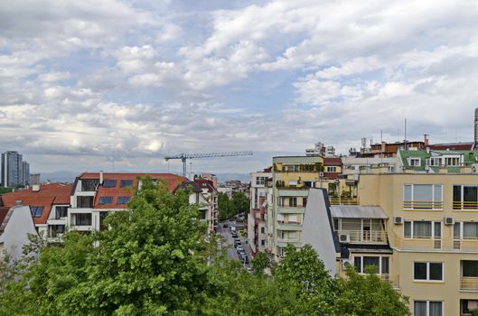 Residential neighborhood with new modern houses against the backdrop of a cityscape in the Bulgarian capital Sofia, Bulgaria