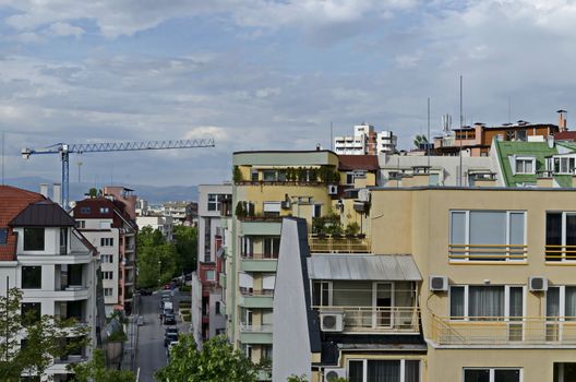 Residential neighborhood with new modern houses against the backdrop of a cityscape in the Bulgarian capital Sofia, Bulgaria