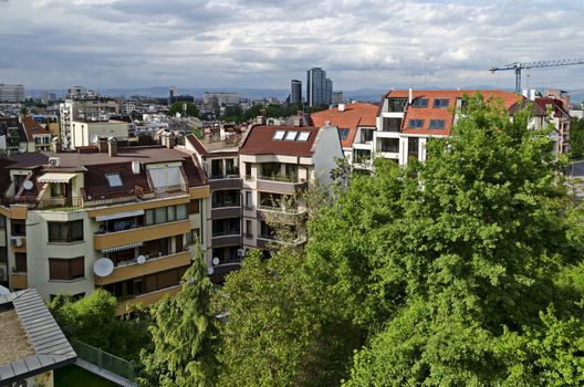 Residential neighborhood with new modern houses against the backdrop of a cityscape in the Bulgarian capital Sofia, Bulgaria