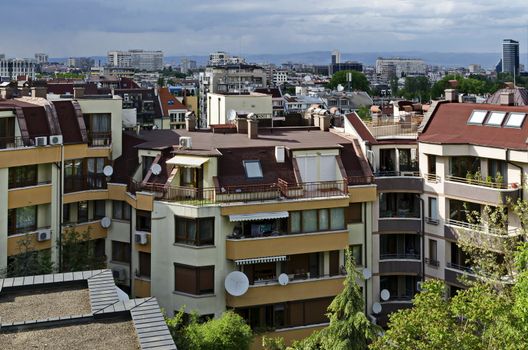 Residential neighborhood with new modern houses against the backdrop of a cityscape in the Bulgarian capital Sofia, Bulgaria