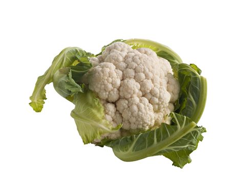 On white background cauliflower with green leaves close-up