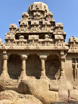 Dharmaraja Ratha is a monument in the Pancha Rathas is an example of monolith Indian rock-cut architecture. Resembling a chariot ratha, it is carved out of a single, long stone of pink granite. This is one of the Group of Monuments at Mahabalipuram and also a UNESCO World Heritage Site. The unfinished structure is dedicated to the Lord Shiva.