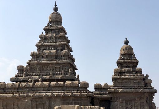 Shore temple is the structural building built with the block of granite at 8th Century AD. It is one of the Group of Monuments at Mahabalipuram and it has been classified as a UNESCO World Heritage Site. Shore temple is the oldest structural rock-cut stone temples of South India and contains complex of temples and shrines. This temple complex is initiated by King  Narasimhavarman II and it is called one of the Seven Pagodas in ancient times.