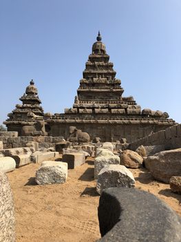 Shore temple is the structural building built with the block of granite at 8th Century AD. It is one of the Group of Monuments at Mahabalipuram and it has been classified as a UNESCO World Heritage Site. Shore temple is the oldest structural rock-cut stone temples of South India and contains complex of temples and shrines. This temple complex is initiated by King  Narasimhavarman II and it is called one of the Seven Pagodas in ancient times.