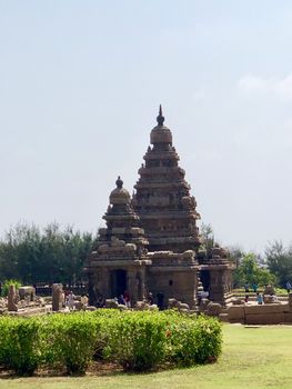 Shore temple is the structural building built with the block of granite at 8th Century AD. It is one of the Group of Monuments at Mahabalipuram and it has been classified as a UNESCO World Heritage Site. Shore temple is the oldest structural rock-cut stone temples of South India and contains complex of temples and shrines. This temple complex is initiated by King  Narasimhavarman II and it is called one of the Seven Pagodas in ancient times.