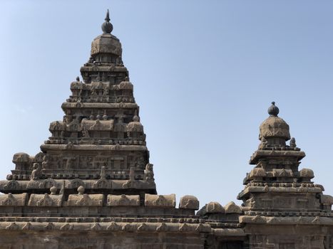 Shore temple is the structural building built with the block of granite at 8th Century AD. It is one of the Group of Monuments at Mahabalipuram and it has been classified as a UNESCO World Heritage Site. Shore temple is the oldest structural rock-cut stone temples of South India and contains complex of temples and shrines. This temple complex is initiated by King  Narasimhavarman II and it is called one of the Seven Pagodas in ancient times.