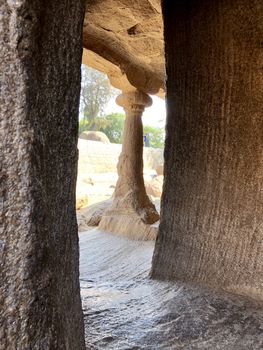 Pancha Rathas is an example of monolith Indian rock-cut architecture. Resembling a chariot ratha, it is carved out of a single, long stone of pink granite. This is one of the Group of Monuments at Mahabalipuram and also a UNESCO World Heritage Site. In this view monuments of Pancha Rathas are beautifully captures from the grass meadow area.