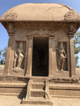 Draupadi Ratha is a monument in the Pancha Rathas is an example of monolith Indian rock-cut architecture. Resembling a chariot ratha, it is carved out of a single, long stone of pink granite. This is one of the Group of Monuments at Mahabalipuram and also a UNESCO World Heritage Site. The unfinished structure is dedicated to the goddess Durga.