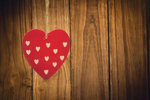 Cute heart decoration against wooden table