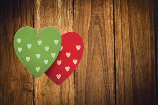 Cute heart decorations against wooden table