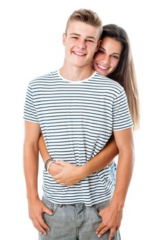 Close up portrait of handsome teen boy with girlfriend embracing from behind.Isolated on white background.