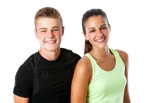 Close up portrait of attractive healthy teen couple in sportswear.Isolated on white background.