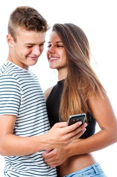 Close up portrait of intimate teen couple having fun with smart phone.Isolated on white background.