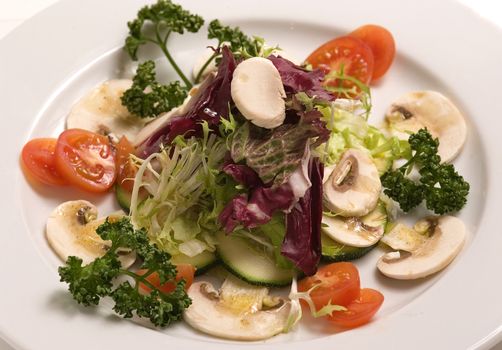Vegetable salad with raw champignons. Healthy vegetarian food.