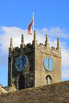 The clock tower of St Michael and All Angels' Church in Haworth, West Yorkshire.  Patrick Bronte, father of the Bronte sisters, served as a minister of the parish in the 19th century.